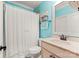 Light teal bathroom with vanity, toilet, and shower at 308 Montrose Dr, Waxhaw, NC 28173