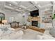 Living room with stone fireplace, built-ins, and coffered ceiling at 308 Montrose Dr, Waxhaw, NC 28173