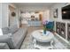 Inviting living room flows into the kitchen, featuring neutral tones and stylish furnishings at 7456 Hartsfield Dr, Lancaster, SC 29720