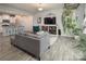 Spacious living room showcasing the open floor plan connecting to the modern kitchen at 7456 Hartsfield Dr, Lancaster, SC 29720