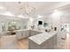 Bright kitchen with marble countertops, modern lighting, stainless appliances, and an eat-in dining area at 1046 Sutton Spring Rd, York, SC 29745