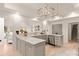 Modern kitchen with marble countertops, stainless steel appliances, pendant lighting, and open access to other living spaces at 1046 Sutton Spring Rd, York, SC 29745