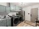 Well-equipped laundry room featuring ample cabinet space and modern washer and dryer at 1046 Sutton Spring Rd, York, SC 29745