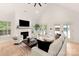 Bright and airy living room with fireplace, vaulted ceiling, and seamless access to outdoor spaces at 1046 Sutton Spring Rd, York, SC 29745