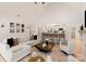 Bright open-concept living room featuring vaulted ceiling and seamless flow to a modern kitchen at 1046 Sutton Spring Rd, York, SC 29745