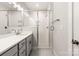 A well lit bathroom featuring a glass-enclosed shower and modern fixtures at 429 Nathaniel Way # Brx0032, Charlotte, NC 28213