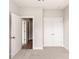 Bedroom with neutral carpet, double-door closet and a view into the hallway at 429 Nathaniel Way # Brx0032, Charlotte, NC 28213