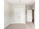 Bedroom with neutral carpet, double-door closet and white trim at 429 Nathaniel Way # Brx0032, Charlotte, NC 28213