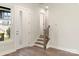 Inviting entryway with wood floors, a staircase with iron railings, and a bright window with views of the outdoors at 429 Nathaniel Way # Brx0032, Charlotte, NC 28213