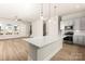 Modern kitchen features a large island, pendant lighting, stainless steel appliances, and ample counter space at 429 Nathaniel Way # Brx0032, Charlotte, NC 28213