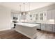 Spacious kitchen featuring modern gray cabinets, stainless steel appliances, a center island, and pendant lighting at 429 Nathaniel Way # Brx0032, Charlotte, NC 28213