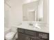 Bathroom with dark gray vanity, white countertop, a sink and a mirror at 433 Nathaniel Way # Brx0033, Charlotte, NC 28213