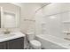 Bright bathroom featuring a shower-tub combo and modern vanity with a white countertop and stylish black and white tile flooring at 433 Nathaniel Way # Brx0033, Charlotte, NC 28213