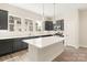 Contemporary kitchen with gray cabinetry, stainless appliances, subway tile backsplash, and quartz island at 433 Nathaniel Way # Brx0033, Charlotte, NC 28213