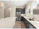 Kitchen with stainless steel appliances, granite countertops, and gray cabinetry at 433 Nathaniel Way # Brx0033, Charlotte, NC 28213