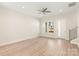 Bright living room with hardwood floors, a ceiling fan, natural light, and a staircase to the second floor at 433 Nathaniel Way # Brx0033, Charlotte, NC 28213