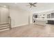 Spacious living room featuring hardwood floors, stairs and a contemporary kitchen with stainless steel appliances at 433 Nathaniel Way # Brx0033, Charlotte, NC 28213