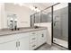 Modern bathroom showcasing a double vanity, framed mirror, and sleek glass-enclosed shower at 437 Nathaniel Way # Brx0034, Charlotte, NC 28213