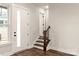 A bright entryway offers views of a staircase with wood treads at 437 Nathaniel Way # Brx0034, Charlotte, NC 28213