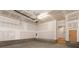 Spacious unfinished garage with concrete floor, block foundation and door to the interior at 437 Nathaniel Way # Brx0034, Charlotte, NC 28213