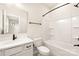 Bathroom featuring a single vanity with matte black fixtures, neutral tile flooring, and a tub/shower combo at 441 Nathaniel Way # Brx0035, Charlotte, NC 28213