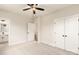 A bedroom featuring a ceiling fan, carpet, and a connecting bathroom and closet at 441 Nathaniel Way # Brx0035, Charlotte, NC 28213