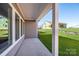 Covered patio with view of grassy backyard and under-construction homes at 1110 Lowland Way, Waxhaw, NC 28173