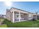 Gray exterior with covered patio and grassy backyard at 1110 Lowland Way, Waxhaw, NC 28173