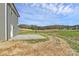 Backyard with a concrete patio and grassy area surrounded by trees at 4122 Old Monroe Marshville Rd, Wingate, NC 28174