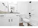 Modern bathroom featuring white cabinets, granite countertops, and a bath with shower at 4122 Old Monroe Marshville Rd, Wingate, NC 28174