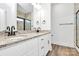 Modern bathroom with double sink vanity, granite countertop, contemporary fixtures, and stylish decorative mirror at 4122 Old Monroe Marshville Rd, Wingate, NC 28174