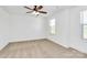 This bedroom features neutral carpet, ceiling fan and lots of natural light at 4122 Old Monroe Marshville Rd, Wingate, NC 28174
