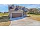 Stylish two-story home featuring a spacious driveway and an attached two-car garage at 4122 Old Monroe Marshville Rd, Wingate, NC 28174