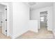Bright upstairs hallway with neutral carpet and fresh white paint, offering access to multiple rooms at 4122 Old Monroe Marshville Rd, Wingate, NC 28174