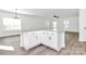 Bright, open-concept kitchen with a large island featuring granite countertops and ample storage space at 4122 Old Monroe Marshville Rd, Wingate, NC 28174