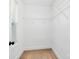 This walk-in closet has white walls, neutral carpet and metal racks at 4122 Old Monroe Marshville Rd, Wingate, NC 28174