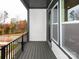 This balcony features an open-air view of the foliage and neighborhood at 428 Nathaniel Way # Brx0044, Charlotte, NC 28213