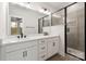 Modern bathroom featuring double sink vanity, sleek black hardware, and glass-enclosed shower with tile surround at 428 Nathaniel Way # Brx0044, Charlotte, NC 28213