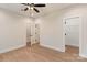 Spacious bedroom featuring hardwood floors, ceiling fan, and access to a large walk-in closet at 428 Nathaniel Way # Brx0044, Charlotte, NC 28213