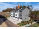 Modern townhome complex featuring multiple units with gray siding, white trim, and attached garages in a residential neighborhood at 428 Nathaniel Way # Brx0044, Charlotte, NC 28213