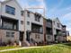 This townhouse features a brick base and grey siding at 428 Nathaniel Way # Brx0044, Charlotte, NC 28213