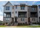 Attractive townhome showcasing a brick foundation, private balcony, and contemporary architectural details at 428 Nathaniel Way # Brx0044, Charlotte, NC 28213