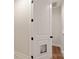 This hallway features wood look flooring and white doors and trim at 428 Nathaniel Way # Brx0044, Charlotte, NC 28213