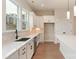 Well-lit kitchen featuring white cabinets, quartz countertops, stainless steel appliances, and a tiled backsplash at 428 Nathaniel Way # Brx0044, Charlotte, NC 28213