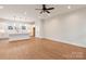 Open floor plan, seamlessly connecting a modern kitchen to a spacious living area with neutral tones and ample lighting at 428 Nathaniel Way # Brx0044, Charlotte, NC 28213