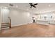 Bright, open-concept living space with stairs, seamlessly connecting to a modern kitchen with a large central island at 428 Nathaniel Way # Brx0044, Charlotte, NC 28213