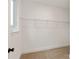 Bright walk-in closet features neutral carpet and a window, complete with wire shelving for optimal organization at 428 Nathaniel Way # Brx0044, Charlotte, NC 28213