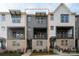 Stylish three-story townhome featuring a brick facade and modern architectural details at 432 Nathaniel Way # Brx0043, Charlotte, NC 28213