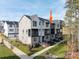 Modern townhome with neutral siding, brick accents, and a well-maintained lawn and landscape at 432 Nathaniel Way # Brx0043, Charlotte, NC 28213