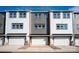 Attached two-car garage offers convenience and curb appeal in this well-maintained townhome at 432 Nathaniel Way # Brx0043, Charlotte, NC 28213